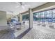 Community pool area with multiple lounge chairs and tables for relaxing by the water at 2475 Bay Berry Dr, Clearwater, FL 33763