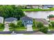 Aerial view of a beautiful two-story home with large yard and lake view at 25521 Bruford Blvd, Land O Lakes, FL 34639