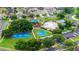 Aerial view showcasing the community pool, playground, and basketball courts at 25521 Bruford Blvd, Land O Lakes, FL 34639