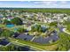 An aerial view of the community showcasing the pool, playground, and lush landscaping at 25521 Bruford Blvd, Land O Lakes, FL 34639