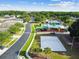 An aerial view of the community amenities including a playground, pool, and volleyball court at 25521 Bruford Blvd, Land O Lakes, FL 34639