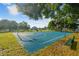 Community basketball court featuring blue and green surfaces and well-maintained landscaping at 25521 Bruford Blvd, Land O Lakes, FL 34639