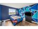 Bedroom with blue walls and modern bed at 25521 Bruford Blvd, Land O Lakes, FL 34639