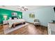 Bright bedroom with a large window, wood floors, and a contemporary design at 25521 Bruford Blvd, Land O Lakes, FL 34639