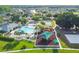 Aerial view of community amenities including a pool, playground, basketball court, and lush green spaces in a Gathering-friendly neighborhood at 25521 Bruford Blvd, Land O Lakes, FL 34639