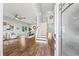 Bright entryway with wood floors, staircase, and open view of living and dining areas at 25521 Bruford Blvd, Land O Lakes, FL 34639