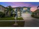 Charming two-story home with well-manicured lawn and lush landscaping at 25521 Bruford Blvd, Land O Lakes, FL 34639