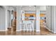Open kitchen area featuring a bar with seating and plenty of wooden cabinets at 25521 Bruford Blvd, Land O Lakes, FL 34639