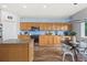 Open kitchen featuring light wood cabinets, stainless steel appliances and eating nook at 25521 Bruford Blvd, Land O Lakes, FL 34639