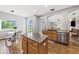 This kitchen features stainless steel appliances, granite countertops, and an island with wood cabinets at 25521 Bruford Blvd, Land O Lakes, FL 34639