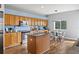 Bright kitchen featuring wood cabinets, stainless appliances, and a breakfast nook at 25521 Bruford Blvd, Land O Lakes, FL 34639