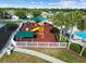 Aerial view showcases a playground with slides and climbing structures near the pool at 25521 Bruford Blvd, Land O Lakes, FL 34639