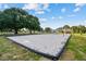 Community sand volleyball court with clear skies and mature trees for a great outdoor experience at 25521 Bruford Blvd, Land O Lakes, FL 34639