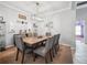 Cozy dining room with a large table, comfortable seating, and elegant lighting for Gathering gatherings at 2814 Duncan Tree Cir, Valrico, FL 33594