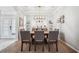 Formal dining room with a large table, seating for eight, and elegant chandelier lighting at 2814 Duncan Tree Cir, Valrico, FL 33594