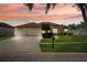 Charming single-story home featuring a three-car garage and a well-manicured lawn at 2814 Duncan Tree Cir, Valrico, FL 33594