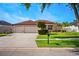 Charming single-story home featuring a three-car garage and a well-manicured lawn at 2814 Duncan Tree Cir, Valrico, FL 33594