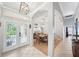Elegant foyer featuring a decorative glass front door and arched entrances to other rooms at 2814 Duncan Tree Cir, Valrico, FL 33594