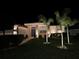 Illuminated front exterior at night with manicured landscaping and inviting pathway leading to the entrance at 2814 Duncan Tree Cir, Valrico, FL 33594