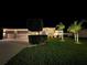 Beautifully landscaped lawn and bushes adorn the front of this home, well lit at night at 2814 Duncan Tree Cir, Valrico, FL 33594