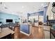 A view of the kitchen, island with seating, granite countertops, stainless steel appliances, and hardwood floors at 2814 Duncan Tree Cir, Valrico, FL 33594
