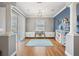The living area has wood floors, blue accent walls, white trim, and access to the outdoor pool area at 2814 Duncan Tree Cir, Valrico, FL 33594