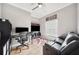 Living room with a mounted TV, and a loveseat at 2814 Duncan Tree Cir, Valrico, FL 33594
