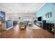 Spacious living room with wood floors, neutral paint colors, and a large entertainment center at 2814 Duncan Tree Cir, Valrico, FL 33594
