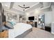 A wide view of the main bedroom with a large bed, seating area, and plenty of space at 2814 Duncan Tree Cir, Valrico, FL 33594