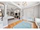 Bright main bedroom with hardwood floors, gray walls, and coffered ceilings at 2814 Duncan Tree Cir, Valrico, FL 33594