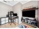 Modern home office featuring a large screen tv and contemporary furnishings at 2814 Duncan Tree Cir, Valrico, FL 33594