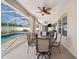 Covered patio features dining set, ceiling fans, and views of the screened pool and well-maintained backyard at 2814 Duncan Tree Cir, Valrico, FL 33594