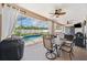 Outdoor living area featuring a dining set, barbecue, and a screened-in pool with a view to backyard at 2814 Duncan Tree Cir, Valrico, FL 33594