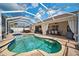 Beautiful screened-in pool and patio area, complete with lush landscaping, perfect for outdoor enjoyment at 2814 Duncan Tree Cir, Valrico, FL 33594