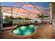 Inviting backyard pool with brick pavers, a screen enclosure and a relaxing hot tub at 2814 Duncan Tree Cir, Valrico, FL 33594
