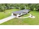 Aerial shot of a beautiful home with an attached garage and well-maintained landscaping at 2933 Stearns Rd, Valrico, FL 33596