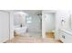 Modern bathroom features a soaking tub, walk-in shower, and white vanity at 2933 Stearns Rd, Valrico, FL 33596