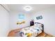 Bright bedroom with a transportation theme and hardwood floors at 2933 Stearns Rd, Valrico, FL 33596