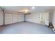 Spacious two-car garage with an epoxy floor and an automatic door at 2933 Stearns Rd, Valrico, FL 33596