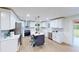 Modern kitchen with stainless steel appliances, white cabinetry, and a center island at 2933 Stearns Rd, Valrico, FL 33596