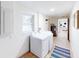 Spacious laundry room with washer, dryer, window, and view to additional rooms at 2933 Stearns Rd, Valrico, FL 33596