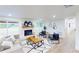 Bright living room with a brick fireplace, modern furniture, and hardwood floors at 2933 Stearns Rd, Valrico, FL 33596