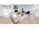 Modern living room with a fireplace, stylish decor, and lots of natural light at 2933 Stearns Rd, Valrico, FL 33596