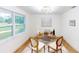 Bright home office with stylish decor, a rustic wood desk, and hardwood floors at 2933 Stearns Rd, Valrico, FL 33596