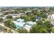 Aerial view of the property featuring colorful condominiums and lush landscaping in a residential area at 3002 W Cleveland St # D4, Tampa, FL 33609
