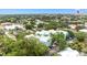 Aerial view of a neighborhood featuring colorful condominiums and lush landscaping with downtown in the distance at 3002 W Cleveland St # D4, Tampa, FL 33609