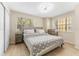 A brightly lit bedroom with a large window and tile floors at 3002 W Cleveland St # D4, Tampa, FL 33609