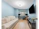 Well-lit bedroom features a desk, TV, pull-out sofa and tile floors at 3002 W Cleveland St # D4, Tampa, FL 33609