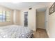 A bright bedroom with tile floors and attached bathroom with walk-in shower at 3002 W Cleveland St # D4, Tampa, FL 33609