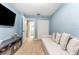 Cozy bedroom features a pull-out sofa, a desk and tile floors at 3002 W Cleveland St # D4, Tampa, FL 33609